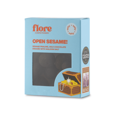 Draže od mliječne čokolade sa sezam pralinom u plavom pakiranju Flore Confectionery