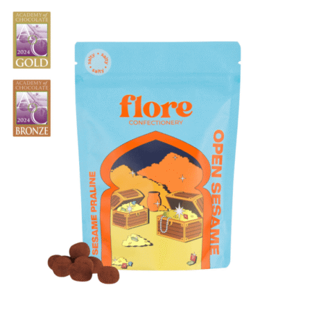 Draže od mliječne čokolade sa sezam pralinom u plavom pakiranju Flore Confectionery